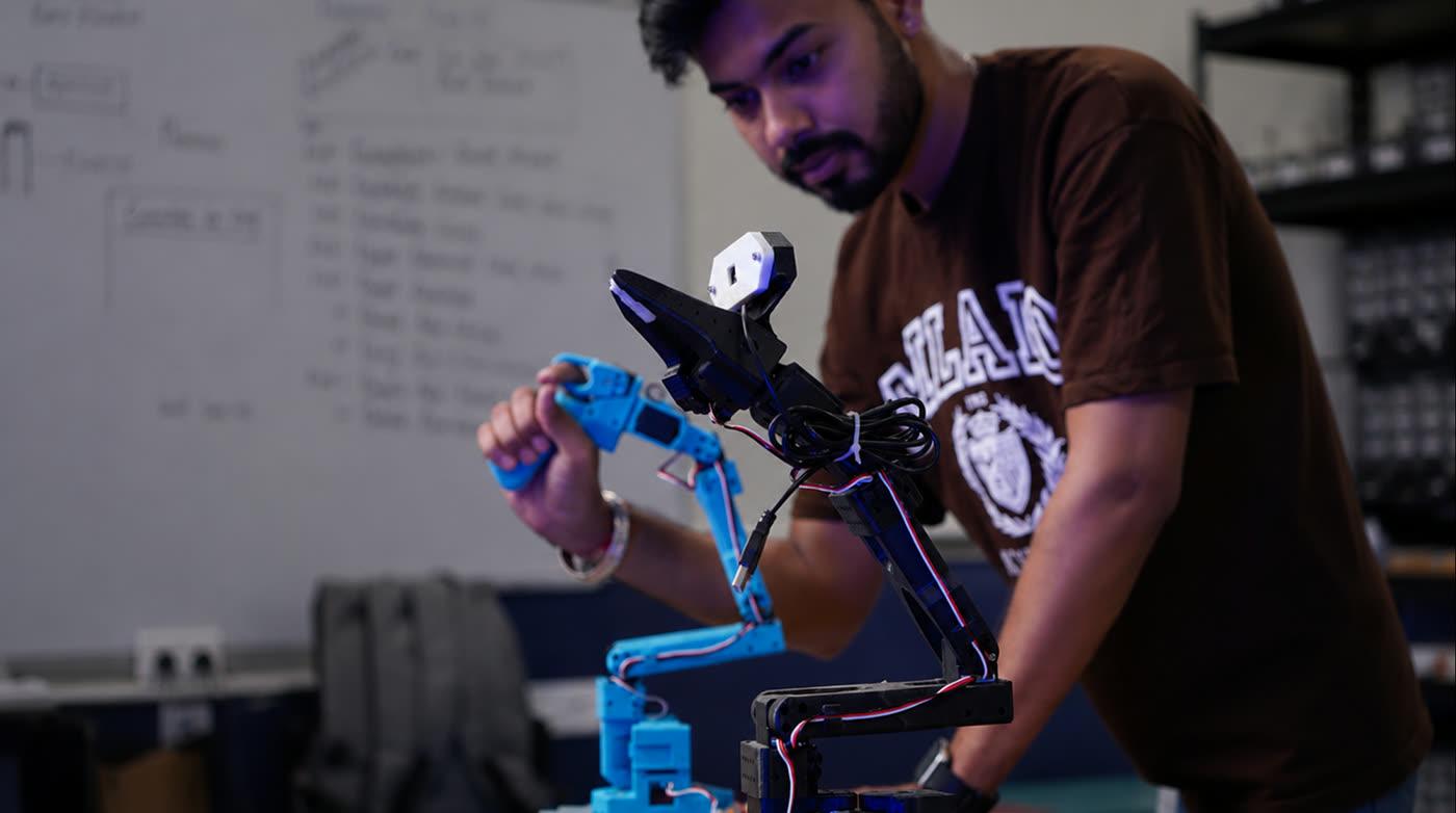 A learner assembling a robotic arm