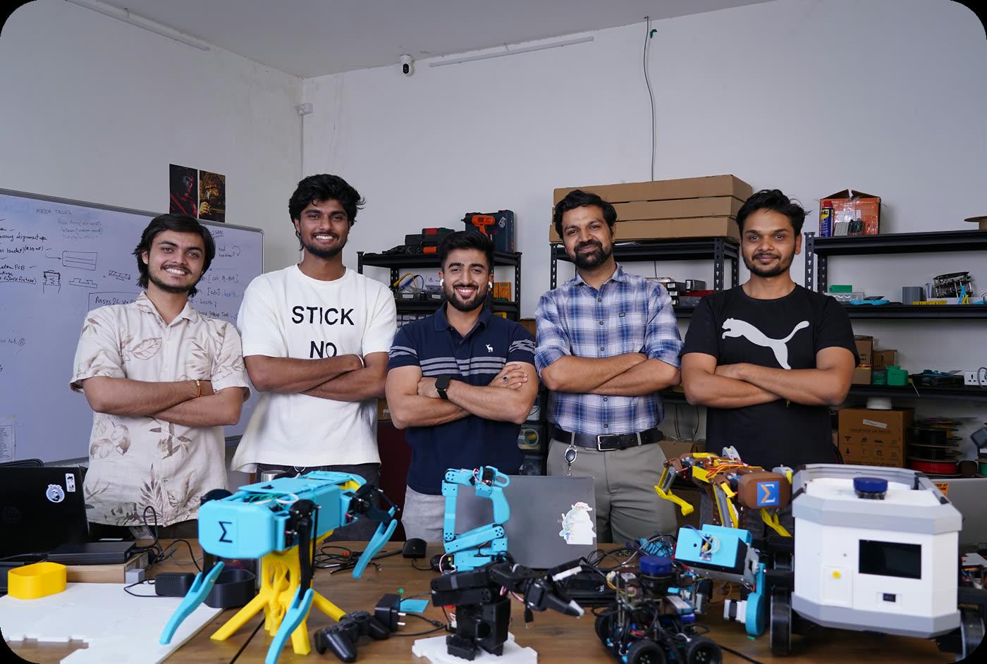 The My Equation team with robots built at the lab