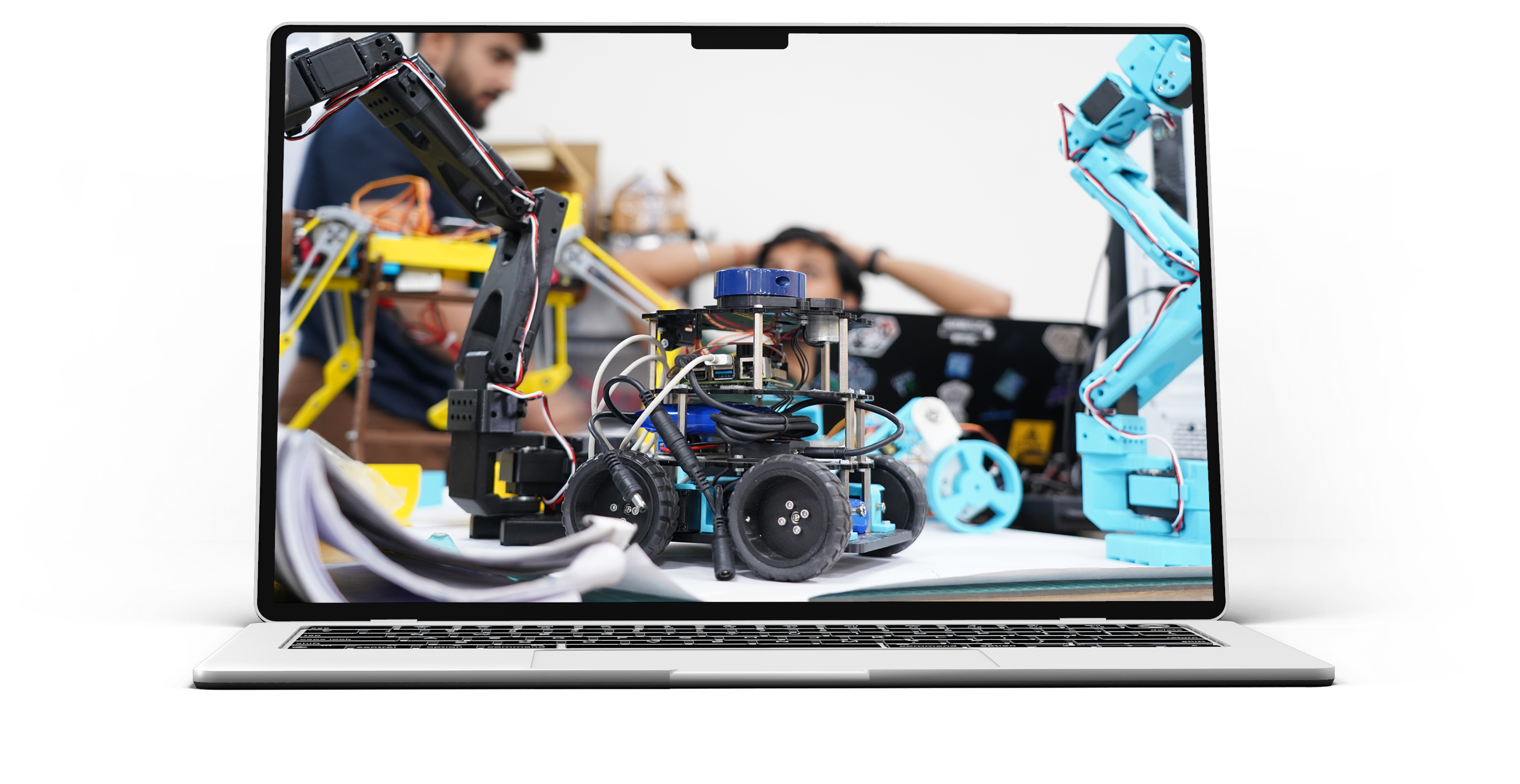 Laptop screen showing students building a robotics project with robotic arms